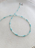 adjustable length tiny beads necklace in light blue color