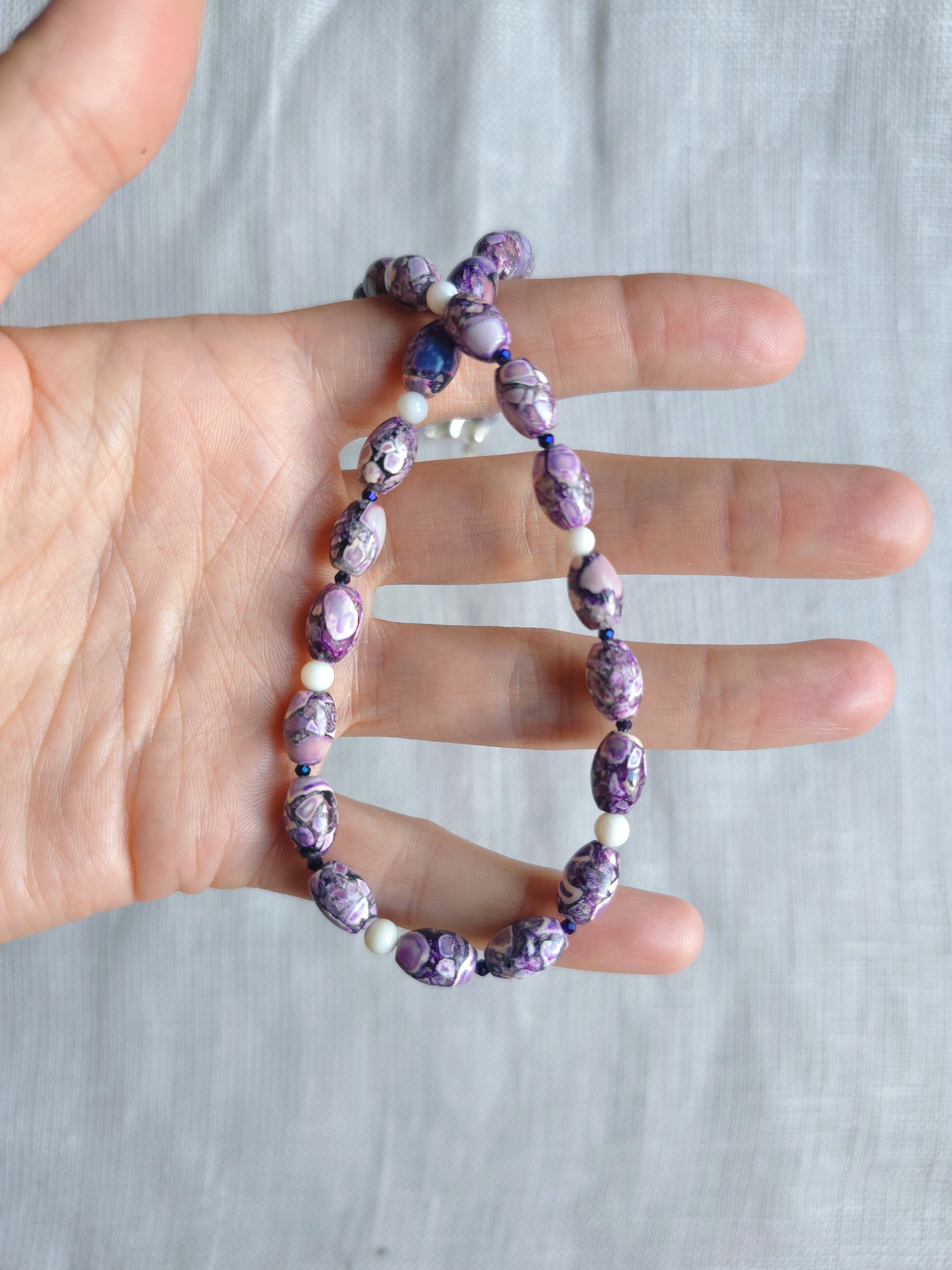 Purple, white beaded necklace