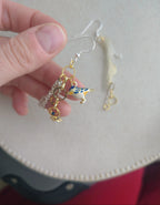 Chain earrings with blue bird pendant. Silver hooks