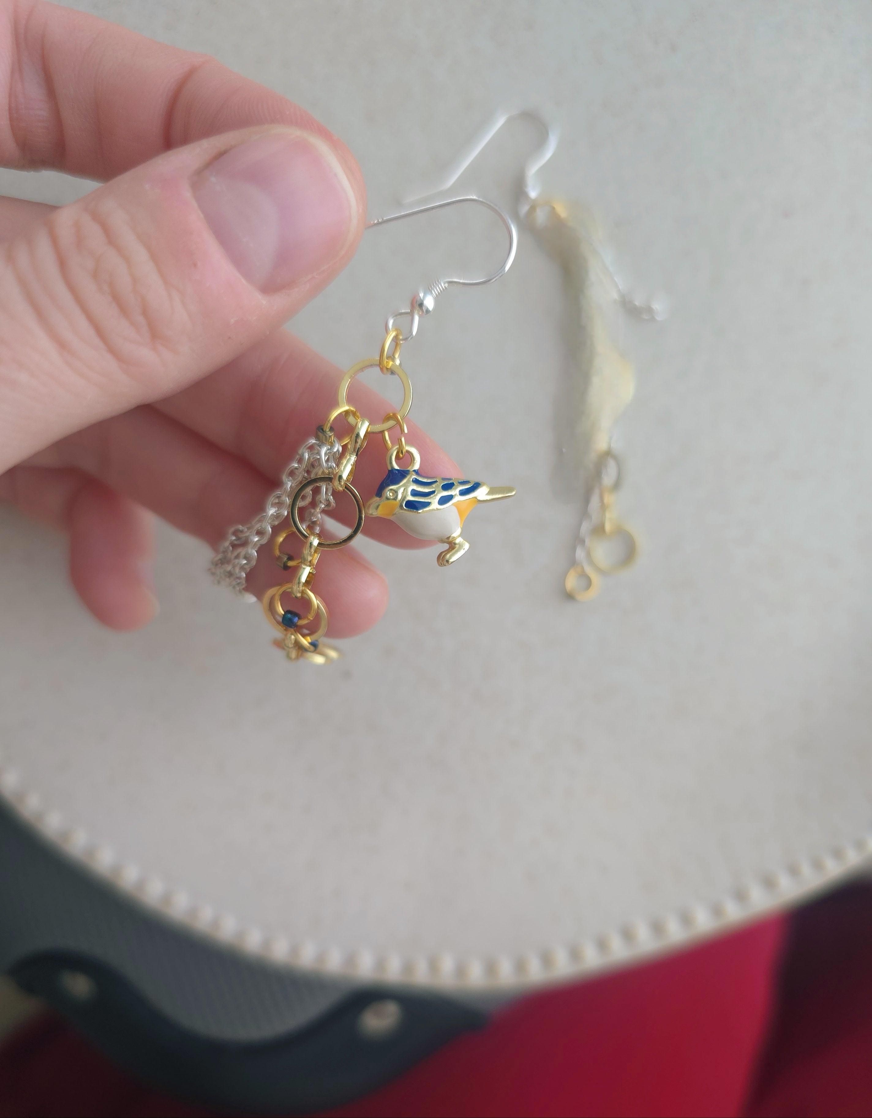 Chain earrings with blue bird pendant. Silver hooks