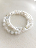 set of 3 white bracelets from different material beads